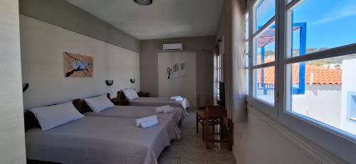 Ένα ή περισσότερα κρεβάτια σε δωμάτιο στο Pelagia Beach Studios