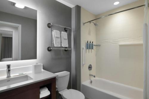 a bathroom with a sink and a toilet and a shower at Residence Inn by Marriott Des Moines Downtown in Des Moines