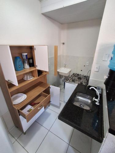 a small bathroom with a toilet and a sink at Apartamento Premium Grand Luxo in Fortaleza