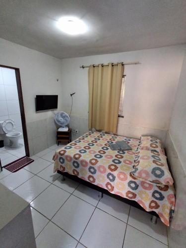 a bedroom with a bed and a television in it at Apartamento Premium Grand Luxo in Fortaleza