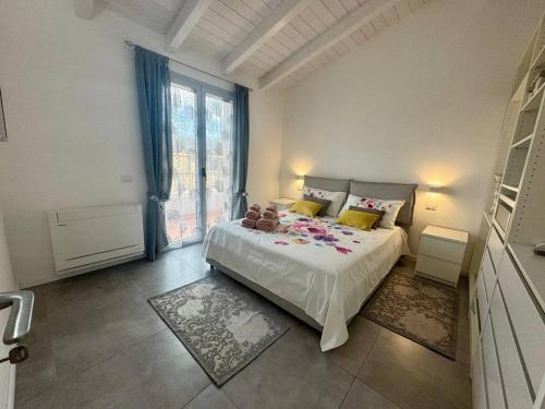 a bedroom with a bed and a large window at Olimpia house, Quartucciu, South Sardinia, IUNT1079 in Quartucciu