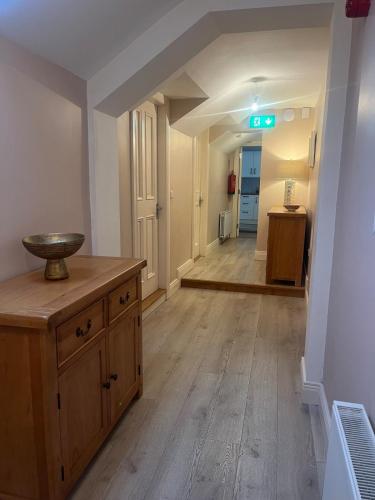 a room with a wooden floor and a hallway at Self catering apartment Silvermines in Nenagh