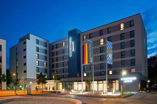 a rendering of the hotel at night at Courtyard by Marriott Oberpfaffenhofen Munich South in Gilching