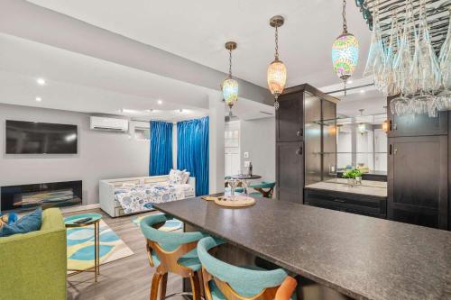 a kitchen and living room with a table and chairs at Walk to Water-Dazzling Sunsets on the Bay in Truro