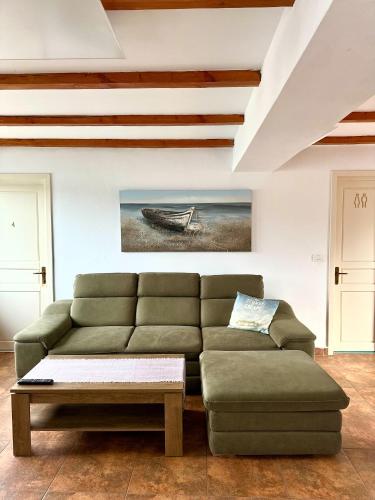 a living room with a couch and a table at Escape in Dubova