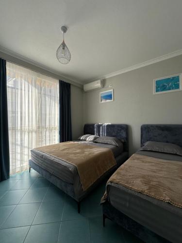 Postel nebo postele na pokoji v ubytování Eri Apartments 2