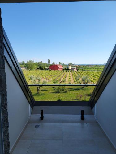 a view from the balcony of a house with a view of a farm at Lahuta e Vjeter Agroturizem in Laç