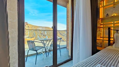 Postel nebo postele na pokoji v ubytování GVC New Gudauri Apartments Loft