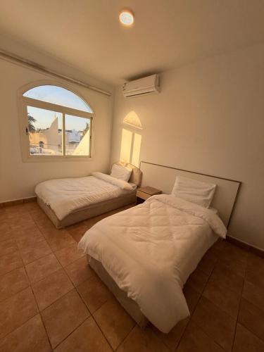 Ένα ή περισσότερα κρεβάτια σε δωμάτιο στο Razz Villa فيلا راز