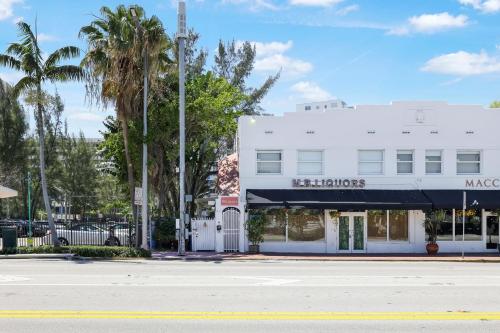 a white building on the side of a street at Alton Rd By At Mine Hospitality in Miami Beach