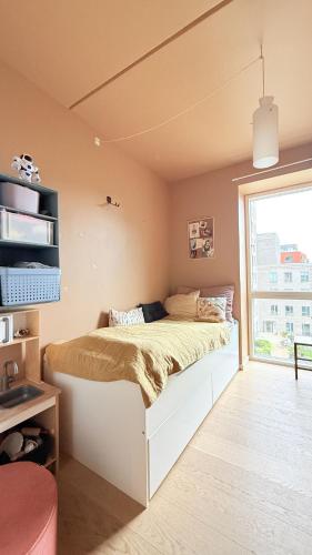 a bedroom with a bed in a room with a window at ApartmentInCopenhagen Apartment 1634 in Copenhagen
