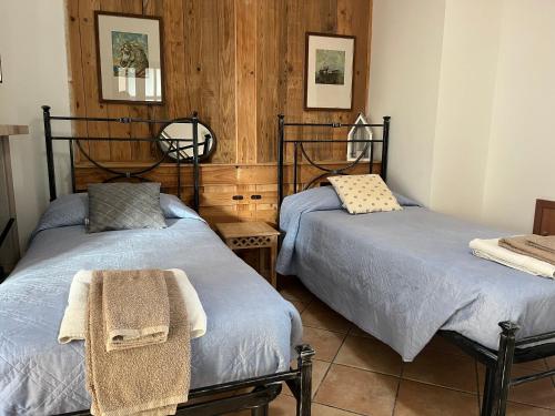 two beds sitting next to each other in a room at La Vista in Otricoli