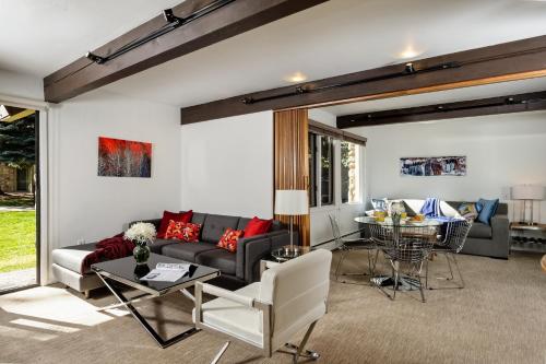 a living room with a couch and a table at Aspen Alps in Aspen