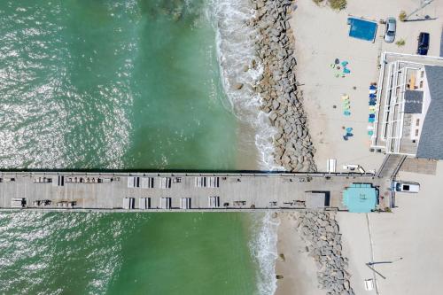 an overhead view of a bridge over the ocean at Paws. . . and RELAX. A PF getaway in the clouds in Carolina Beach