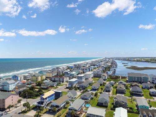 an aerial view of a beach with houses and the ocean at Paws. . . and RELAX. A PF getaway in the clouds in Carolina Beach