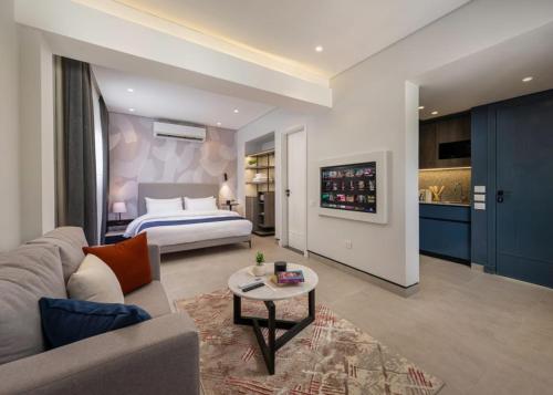 a hotel room with a bed and a living room at Exclusive savings at 22 by spacey #43 Studio in Maadi in Cairo