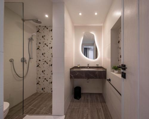 a bathroom with a sink and a shower with a mirror at Exclusive savings at 22 by spacey #43 Studio in Maadi in Cairo