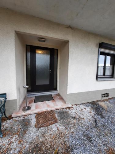 a front door of a house with a window at Guesthouse Les Tilleuls in Fleurus