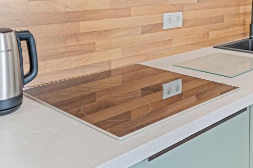 a kitchen counter with a wooden counter top at Appartement für 2 - WLAN - Küche in Haßloch