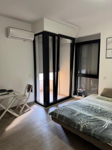 Ένα ή περισσότερα κρεβάτια σε δωμάτιο στο Apartments Indigo