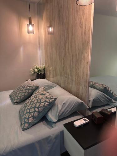 Postel nebo postele na pokoji v ubytování Oasis Urbano San Benito