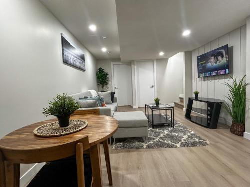 a living room with a table and a couch at Eli's Place in Calgary