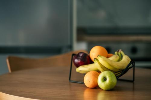 a bowl of fruit sitting on a table at Cranae Tranquil Luxury Villas in Gythio