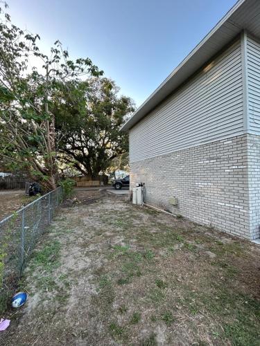 an empty yard in front of a building at The Sunshine State Midpoint in Seffner