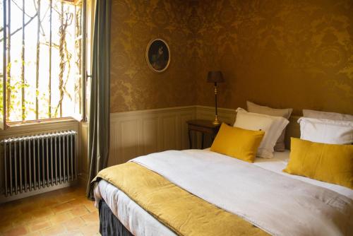 Postel nebo postele na pokoji v ubytování Le Manoir du Plessis