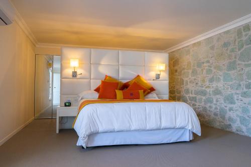 Кровать или кровати в номере Casa Hidalgo Hotel Boutique