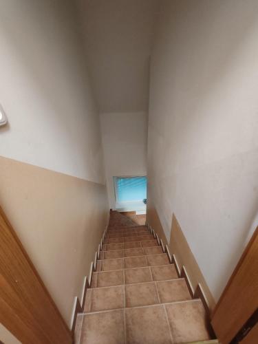 a staircase in a building with a window at apartma Pohorc - Kostanj in Pohorje