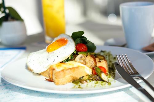 a plate of food with an egg on top at Hilton San Jose La Sabana in San José