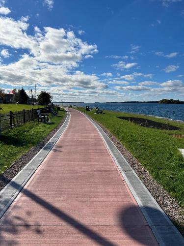 a path next to a body of water at Clayton Dahlia Retreat in Clayton