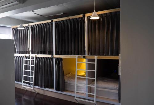 a couple of bunk beds in a room at Movylodge in Bangkok