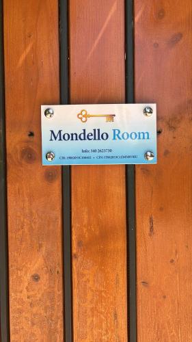 a sign that says monolithic room on a wooden door at Mondello Room in Mondello