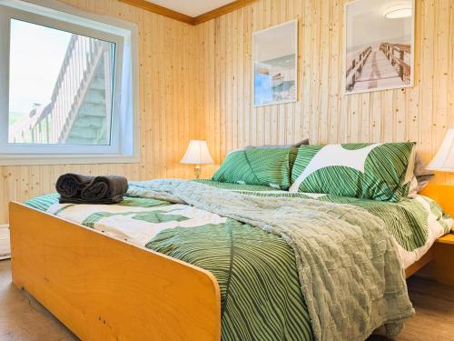 Ένα ή περισσότερα κρεβάτια σε δωμάτιο στο The Great Cabot Lodge