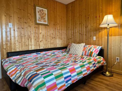 Ένα ή περισσότερα κρεβάτια σε δωμάτιο στο The Great Cabot Lodge