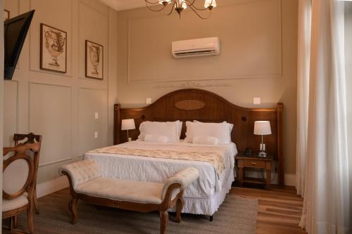 Cama ou camas em um quarto em Johnscher by SJ - San Juan Curitiba