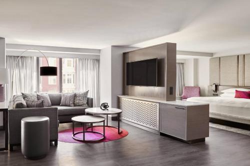 a hotel room with a bed and a living room at San Francisco Marriott Marquis Union Square in San Francisco
