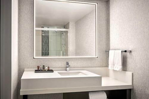 a bathroom with a white sink and a mirror at San Francisco Marriott Marquis Union Square in San Francisco