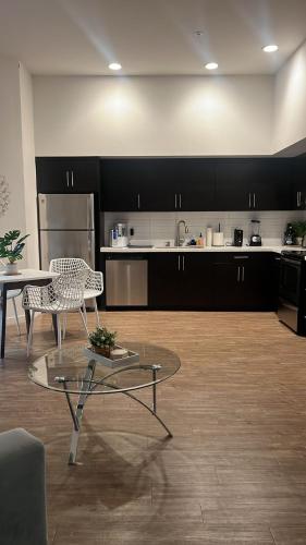 a kitchen with a table and a table and a chair at Exceptional Loft FREE Parking and WIFI in Los Angeles
