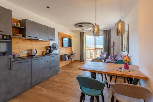 a kitchen and dining room with a table and chairs at Haus Alpenblick in St. Wolfgang