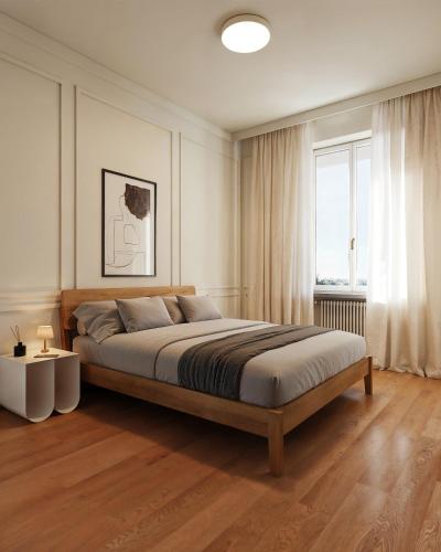 a bedroom with a large bed and a window at Casa Visconti Milano in Milan