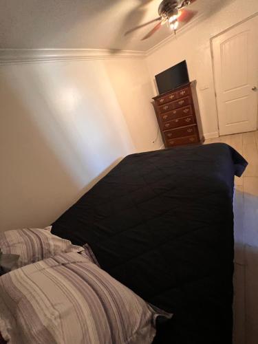 a bedroom with a bed and a ceiling fan at Downtown Secluded Room 2 in Phoenix