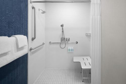 a white bathroom with a shower and a toilet at Fairfield Inn by Marriott Santa Clarita Valencia in Santa Clarita