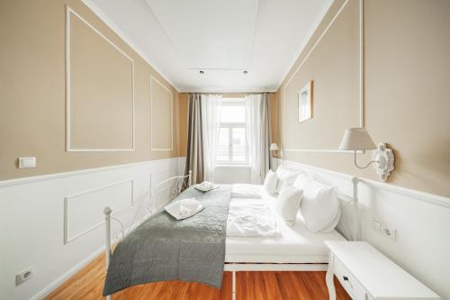 Ένα ή περισσότερα κρεβάτια σε δωμάτιο στο Nobile Schönbrunn Klassik Residences