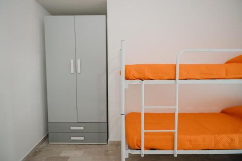 Postel nebo postele na pokoji v ubytování Casa vacanza Ro-Bè