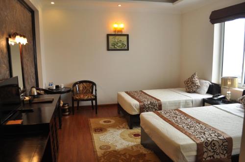 Cama o camas de una habitación en Golden Halong Hotel