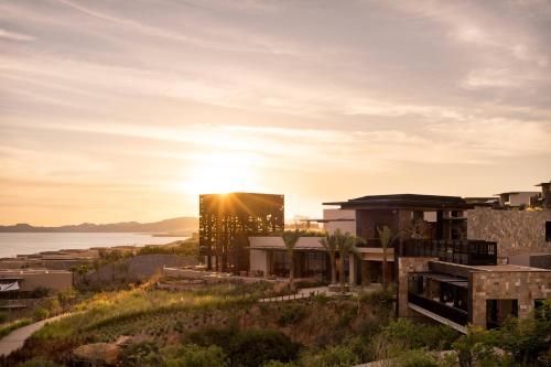 a rendering of a building with the sun setting in the background at Zadún, a Ritz-Carlton Reserve, Los Cabos in San José del Cabo