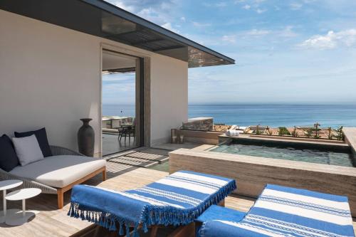 a villa with a swimming pool and a view of the ocean at Zadún, a Ritz-Carlton Reserve, Los Cabos in San José del Cabo